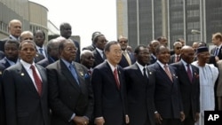 Malawi President and president of African Union Bingu wa Mutharika, front second left, stands with UN Secretary General Ban Ki-moon, as they pose for a group photo with other African heads of states at the AU summit in Addis Ababa, Ethiopia, January 30, 2