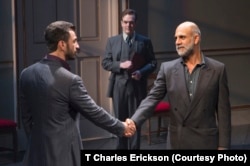 Israeli negotiator Uri Savir (Michael Aronov) shakes hands with his Palestinian counterpart, Ahmed Qurie (Anthony Azizi) in a scene from Oslo