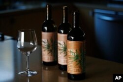 In this Dec. 22, 2017, photo, three bottles of Rebel Coast Winery's cannabis-infused wine is displayed in Los Angeles.