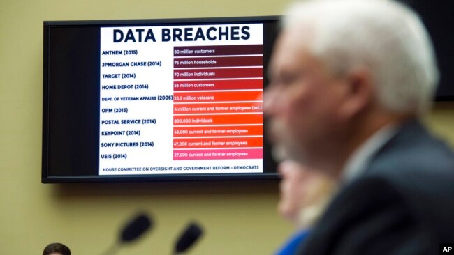 FILE - A chart of data breaches is shown on Capitol Hill in Washington, June 16, 2015, as witnesses testify before the House Oversight and Government Reform Committee's hearing on the Office of Personnel Management data breach.