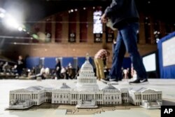 A model of the Capitol is displayed on a giant planning map during a media tour highlighting inaugural preparations being made by the Joint Task Force-National Capital Region for military and civilian planners at the D.C. Armory in Washington, Dec. 14, 2016.
