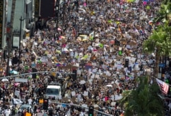 People take part in an All Black Lives Matter march, organized by Black LGBTQ+ leaders, in the aftermath of the death in Minneapolis police custody of George Floyd, in Hollywood, Los Angeles, California, U.S., June 14, 2020.