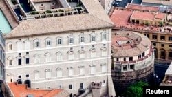 FILE - The Vatican has arrested two people suspected of stealing and leaking confidential documents. The suspects served on a panel on Vatican economic reform. The Vatican bank, previously called the institute for Works of Religion, is shown circa 2011.