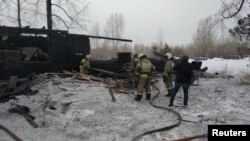 10 o'zbek halok bo'lgan yong'indan keyin... Prichulimskiy qishlog'i, Tomsk, Rossiya, 21-yanvar, 2020