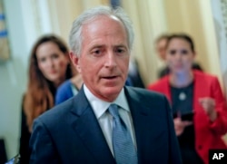 FILE - Sen. Bob Corker, R-Tenn., speaks to members of the media as he arrives for a luncheon with Vice President Mike Pence, on Capitol Hill in Washington, May 2, 2017.