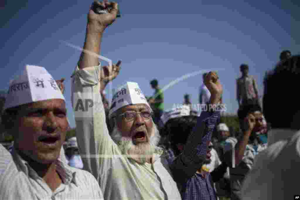 Aam Aadmi Party (AAP), or common man party, supporters shouting slogans gather at Rajghat, the memorial of Mahatma Gandhi after their chief Arvind Kejriwal, was slapped by an attacker during his election campaign in New Delhi, India, Tuesday, April, 8, 20