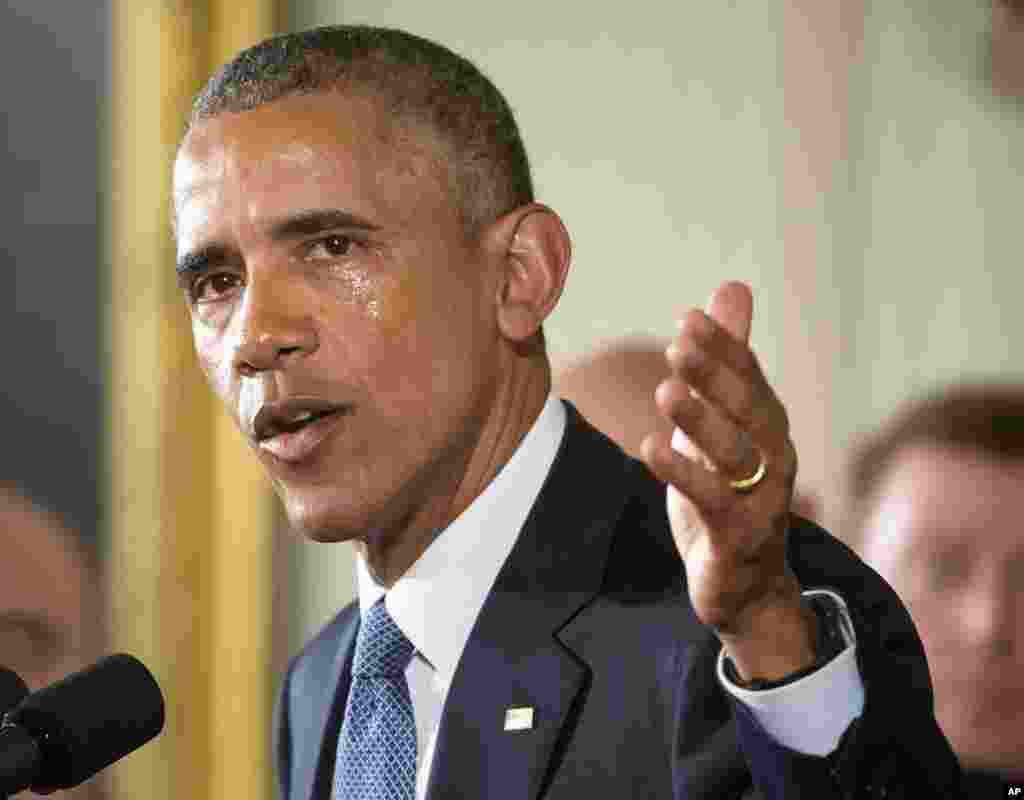 His cheek wet with tears, President Barack Obama recalls the 20 first-graders killed in 2012 at Sandy Hook Elementary School, while speaking in the East Room of the White House in Washington, Jan. 5, 2016, about steps his administration is taking to reduce gun violence.