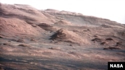 This photo, taken by the Curiosity rover, shows the layered geology of Mars.
