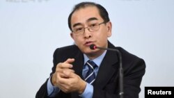 Thae Yong-ho, the former North Korean deputy ambassador to London, gestures while speaking during a news conference at the Government Complex in Seoul, South Korea, Dec. 27, 2016. 