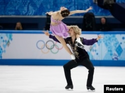 Meryl Davis and Charlie White of the U.S. compete during the figure skating ice dance free dance program at the Sochi 2014 Winter Olympics, Feb. 17, 2014.