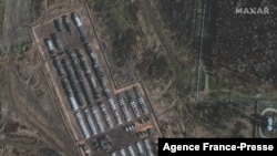 This handout satellite image released by Maxar Technologies and taken on Nov. 1, 2021, shows tanks, armored personnel carriers and support equipment amid the presence of a large ground forces deployment on the northern edge of the town of Yelnya, Smolensk Oblast, Russia.