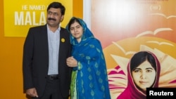 Activist Malala Yousafzai (R) and her father Ziauddin Yousafzai (L) attends the premiere of "He Named Me Malala" at the Ziegfeld Theater in Manhattan, New York, Sept. 24, 2015. 