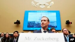 Facebook CEO Mark Zuckerberg arrives to testify before a House Energy and Commerce hearing on Capitol Hill in Washington, Wednesday, April 11, 2018, about the use of Facebook data to target American voters in the 2016 election and data privacy.