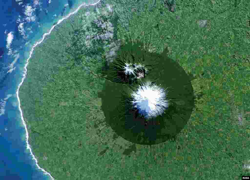 Egmont National Park in New Zealand with Mt. Taranaki at its center is seen in a Landsat 8 satellite image taken July 3, 2014 and released by NASA, Friday. The image is from the book &quot;Sanctuary: Exploring the World&#39;s Protected Areas from Space.&quot; (NASA/USGS)