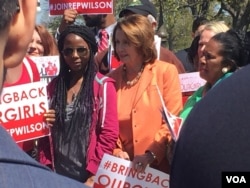 Democratic minority leader Nancy Pelosi, right, shows her support Thursday on the U.S. Capitol for the Nigerian girls kidnapped two years ago by Boko Haram militants. (C. Saine/VOA)