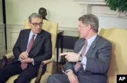 FILE - President Bill Clinton and UN Secretary-General Boutros Boutros-Ghali discuss aerial drops of food rand medicine in eastern Bosnia planned by the U.S., in the Oval Office of the White House in Washington, Feb. 23, 1993.