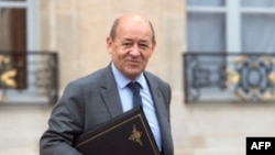 FILE - French Defense Minister Jean-Yves Le Drian at Elysee presidential Palace.