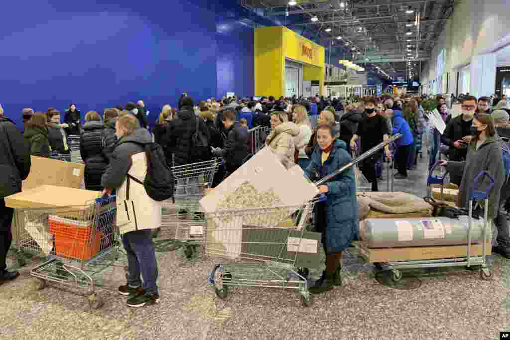 People wait in long lines to pay for their purchases at the IKEA store on the outskirts of Moscow, Russia.&nbsp;IKEA is closing its stores and pausing all sourcing in Russia and Belarus from Friday, March 4.