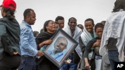 Ethiopian relatives of crash victims mourn and grieve at the scene where the Ethiopian Airlines Boeing 737 Max 8 crashed shortly after takeoff on Sunday killing all 157 on board, near Bishoftu, south-east of Addis Ababa, in Ethiopia Thursday, March 14, 20