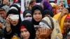 Filipino Muslims join a protest at the Philippine Congress, Feb. 3, 2016, at suburban Quezon city, northeast of Manila, Philippines. 