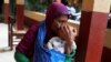 Sobrevivientes del tsunami de Indonesia realizan vigilia en Navidad