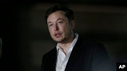 FILE - Tesla CEO and founder of the Boring Company Elon Musk speaks at a news conference, June 14, 2018, in Chicago.