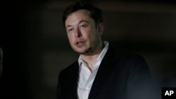 FILE - Tesla CEO and founder of the Boring Company Elon Musk speaks at a news conference, June 14, 2018, in Chicago.