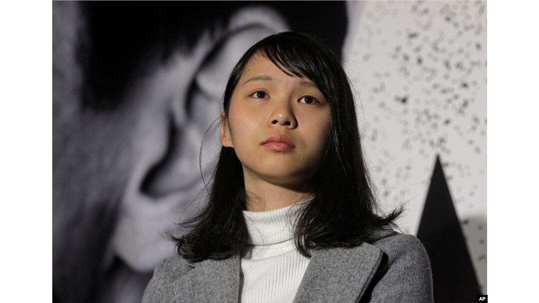 FILE - Agnes Chow, 21, a member of democracy activist Joshua Wong's Demosisto party, attends a protest in Hong Kong, Jan. 28, 2018.