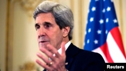 U.S. Secretary of State John Kerry speaks during a news conference at the U.S. ambassador's residence in Paris, March 30, 2014.