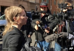 FILE - Chelsea Manning addresses the media outside federal court in Alexandria, Va. The former Army intelligence analyst was ordered to jail Friday, March 8, 2019, for refusing to testify to a Virginia grand jury investigating Wikileaks.