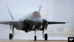 FILE - An F-35 arrives at it new operational base, Sept. 2, 2015, at Hill Air Force Base, in northern Utah.