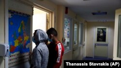 A prisoner looks a map of Europe at Avlona's prison school, north of Athens, Greece, February 10, 2021. (AP Photo/Thanassis Stavrakis)