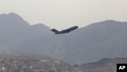 A U.S military aircraft takes off from the Hamid Karzai International Airport in Kabul, Afghanistan, Monday, Aug. 30, 2021. (AP Photo/Wali Sabawoon)