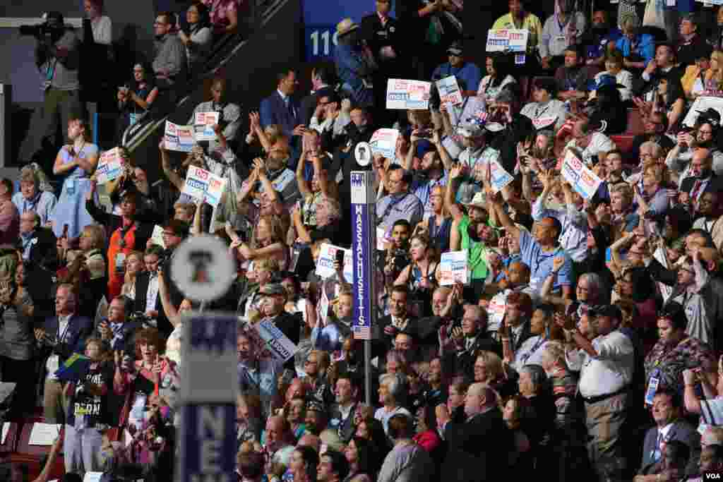 Delegates watch and cheer as the roll call votes are cast at the Democratic National Convention, July 26, 2016