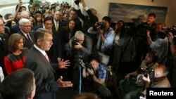 U.S. Speaker of the House John Boehner (2nd L) speaks to the media with other Republican House members in Washington, Oct. 10, 2013.