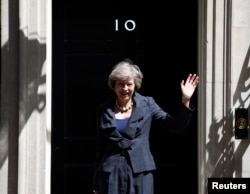 Wednesday, waves as she leaves after a cabinet meeting at number 10 Downing Street in central London, Britain on July 12, 2016. (Reuters)