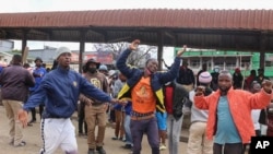 FILE: Public transport workers dance and chant political slogans at the bus rank in Manzini on 10.19.2021 as they demand democratic reforms. 
