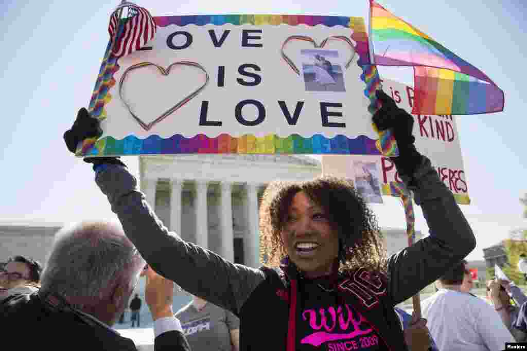 Ikeita Cantu holds a sign supporting same sex marriage in front of the Supreme Court before the court hears arguments about gay marriage in Washington, April 28, 2015.