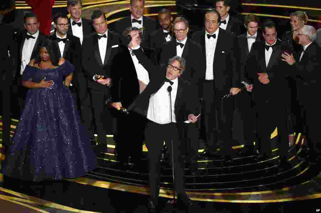 Peter Farrelly, center, and the cast and crew of "Green Book" accept the award for best picture at the Oscars on Sunday, Feb. 24, 2019, at the Dolby Theatre in Los Angeles.