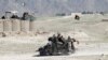 FILE - Afghan special forces patrol in Pandola village near the site of a U.S. bombing in the Achin district of Nangarhar province in eastern Afghanistan April 14, 2017. 