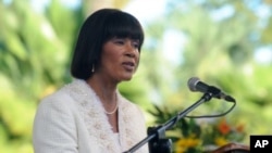 FILE - Jamaica's Prime Minister Portia Simpson Miller delivers her inaugural speech after being sworn in at King's House in Kingston, Jan. 5, 2012.