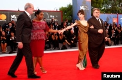 Director Guillermo del Toro, right, poses with actors Sally Hawkins, 2nd right, Richard Jenkins' left, and Octavia Spencer during a red carpet event for the movie "The Shape of Water" at the 74th Venice Film Festival in Venice, Italy, Aug. 31, 2017.