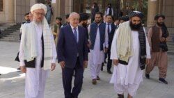 Uzbek Foreign Minister Abdulaziz Kamilov walks with the members of the Taliban government in Kabul, Afghanistan, Oct. 7, 2021. (mfa.uz)