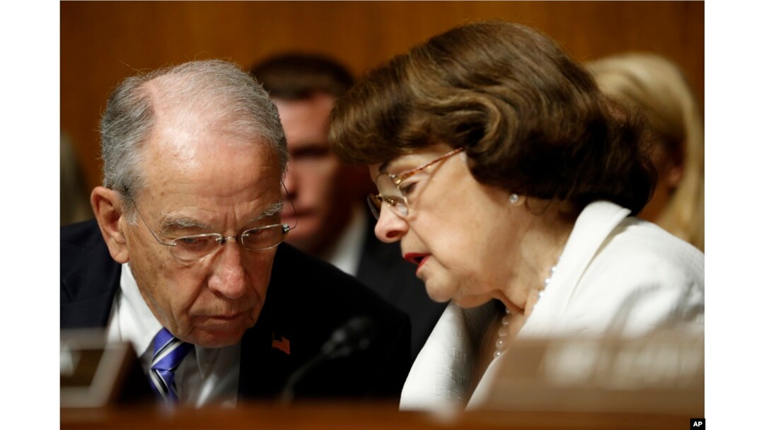FILE - Senate Judiciary Committee Chairman Chuck Grassley, R-Iowa, talks with the committee's ranking member, Sen. Dianne Feinstein, D-California, on Capitol Hill in Washington, July 12, 2017.