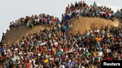 Mining community gathers at a hill dubbed the 'Hill of Horror' during a memorial service for miners killed during clashes at Lonmin's Marikana platinum mine in Rustenburg, 100 kilometers northwest of Johannesburg, South Africa, August 23, 2012.