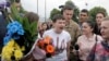 Ukrainian pilot Nadezhda Savchenko, center, speaks to the media upon her arrival at Boryspil airport outside Kiev, Ukraine, May 25, 2016.