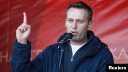 FILE - Russian lawyer and blogger Alexei Navalny attends a rally in Moscow, Oct. 22, 2011.