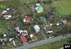 An aerial photo shows houses destroyed at the height of Typhoon Mangkhut in Alcalá, in Cagayan province, Sept. 16, 2018. Mangkhut slammed into the northern Philippines with violent winds and torrential rains, as authorities warned millions in its path.