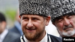 FILE - Chechen leader Ramzan Kadyrov smiles during a government-organized event marking Chechen language day in central Grozny, April 25, 2013.