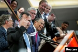 Dean Baquet (C), executive editor of The New York Times, celebrates the announcement of the 2017 Pulitzer Prizes in The Times office in New York, April 10, 2017.